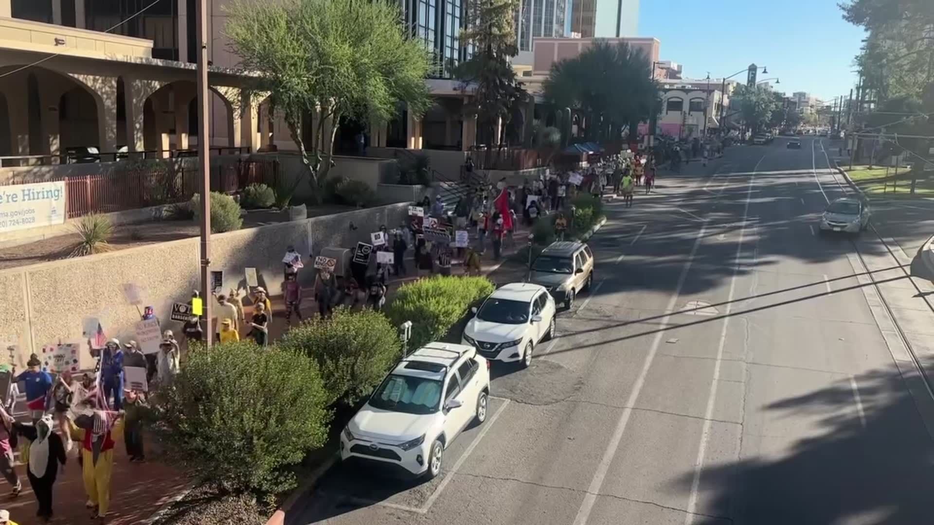 Protesters march through downtown Tucson as part of the nationwide No Kings protests.
